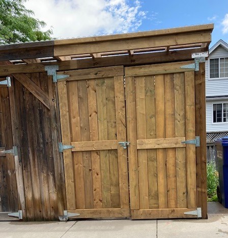 The addition to our back shed allows us to store our garbage dumpsters out of sight